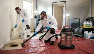 Sewer backup cleanup crew restoring a Dayton, OH home after water damage and contamination
